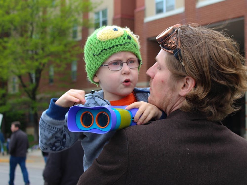 Theodore Williamson, 4, checks out the crowd of science lovers around him. The Williamson family attended the Indianapolis March for Science on Saturday. 