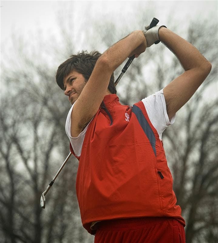 Senior Jorge Campillo tracks his shot during practice Feb. 26 at the IU golf course's driving range.  Campillo was recently named Big Ten Golfer of the Year for 2008-2009.