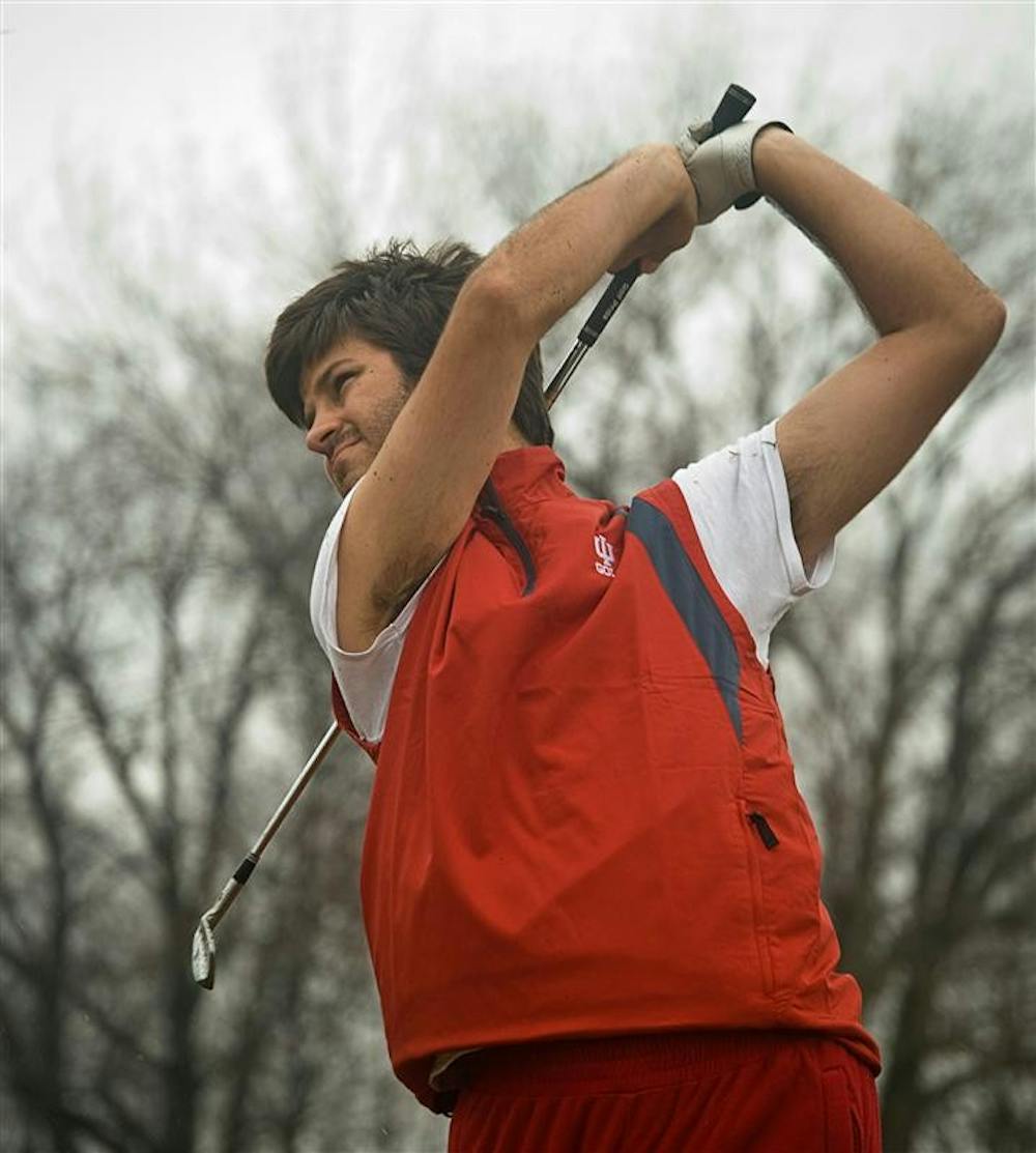 Senior Jorge Campillo tracks his shot during practice Feb. 26 at the IU golf course's driving range.  Campillo was recently named Big Ten Golfer of the Year for 2008-2009.