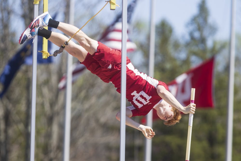 <p>Then-junior pole vaulter Nathan Stone flies over the bar April 23, 2022, at the Robert C. Haugh Complex. Indiana track and field hosted the Indiana Invitational over the weekend.</p>