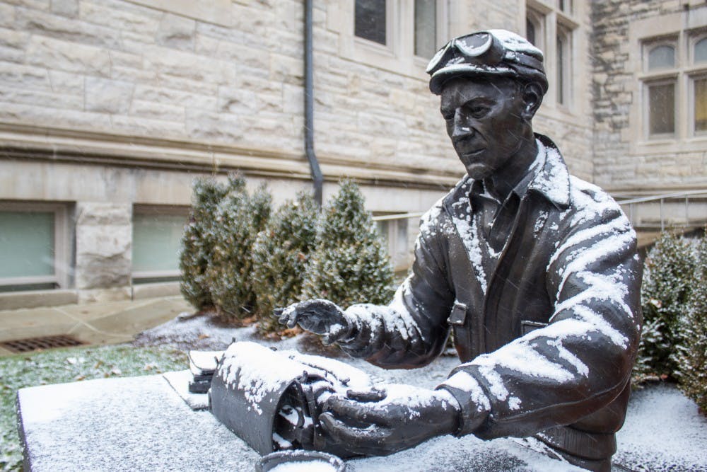 <p>The Ernie Pyle statue located in front of Franklin Hall is covered in snow Nov. 26.</p>