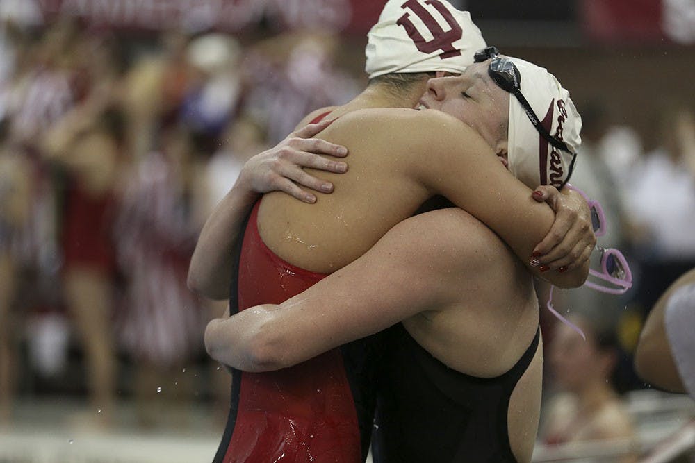 Sophomore Gia Dalesandro (left) hugs Sophomore Bailey Pressey (right) after placing 1st and 3rd respectively in the 200 Butterfly at the Big Ten Women's Swimming and Diving Championships on Saturday in Columbus, Ohio. 