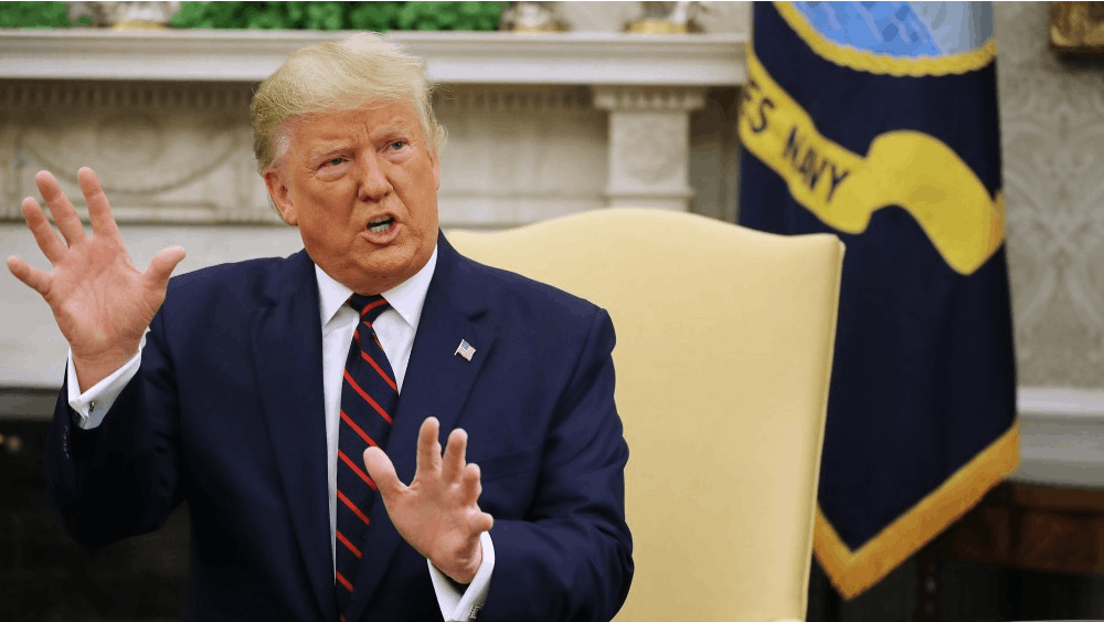 President Donald Trump talks to reporters in the Oval Office while Finnish President Sauli Niinisto visits Oct. 2 at the White House in Washington, D.C.