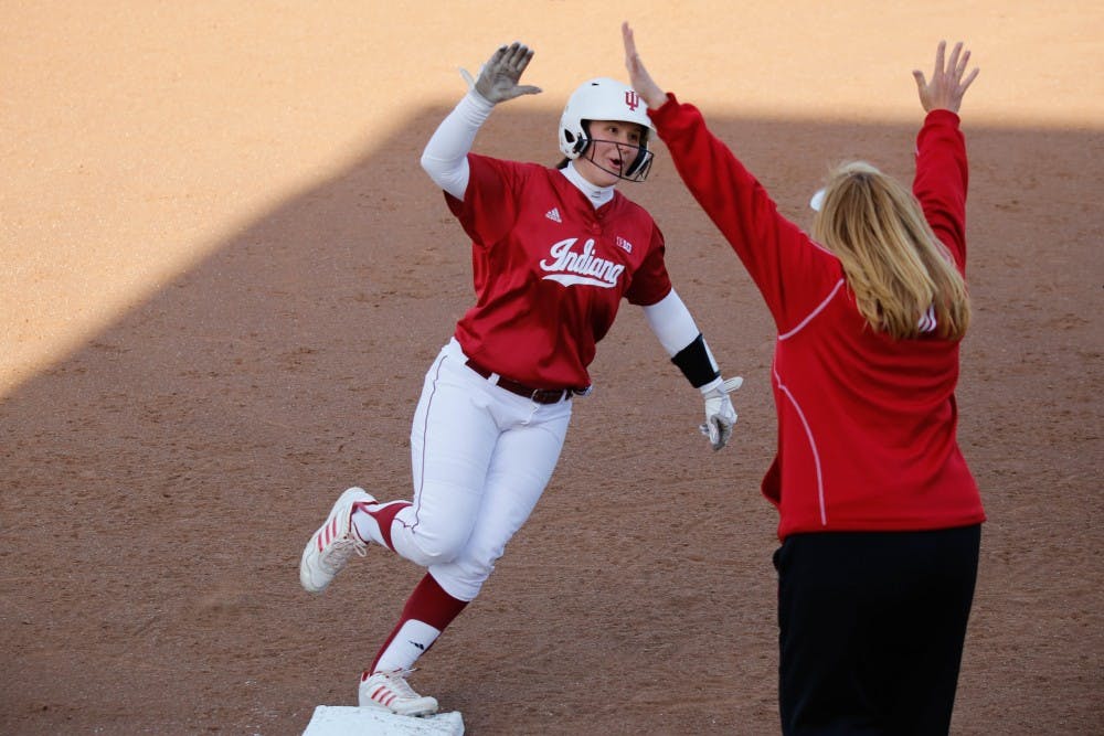 Junior Michelle Huber high-fives her coach, Michelle Gardner, after hitting a home run during IU's first game against Purdue on April 22, 2015 at Andy Mohr Field. Gardner, who resigned as head softball coach in May, was replaced by Shonda Stanton on Saturday.