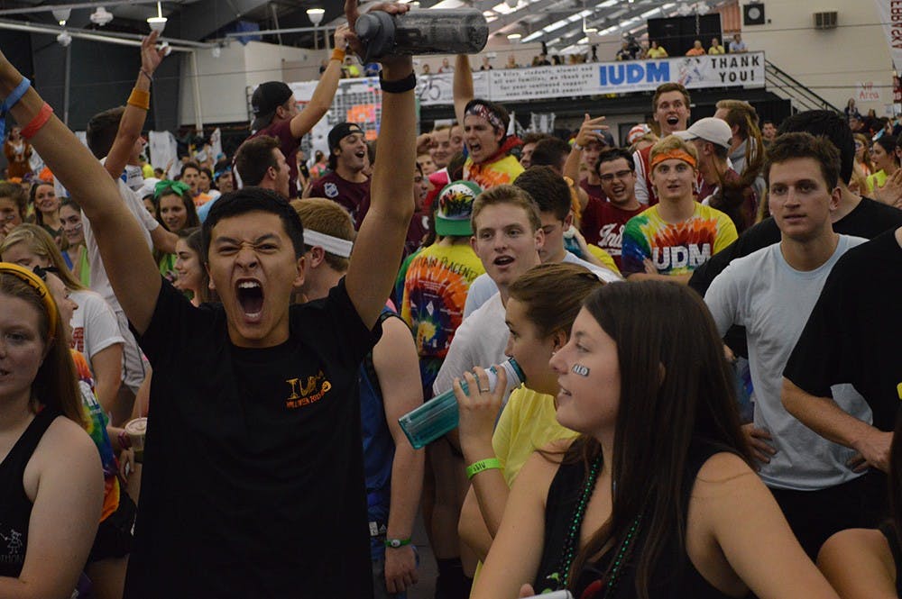 Sophomore Jaeson Chang screams after donations were made during the Indiana University Dance Marathon Saturday evening at the IU Tennis Center.