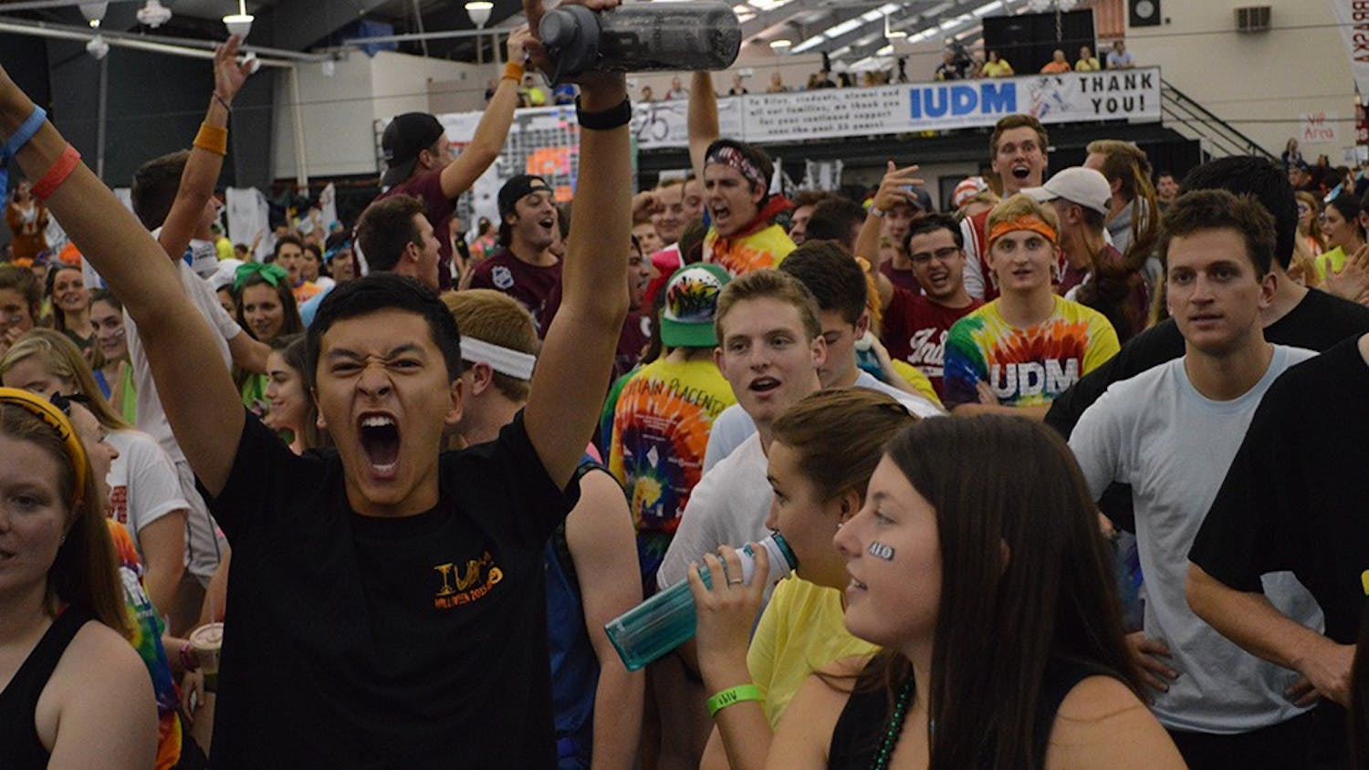 Sophomore Jaeson Chang screams after donations were made during the Indiana University Dance Marathon Saturday evening at the IU Tennis Center.