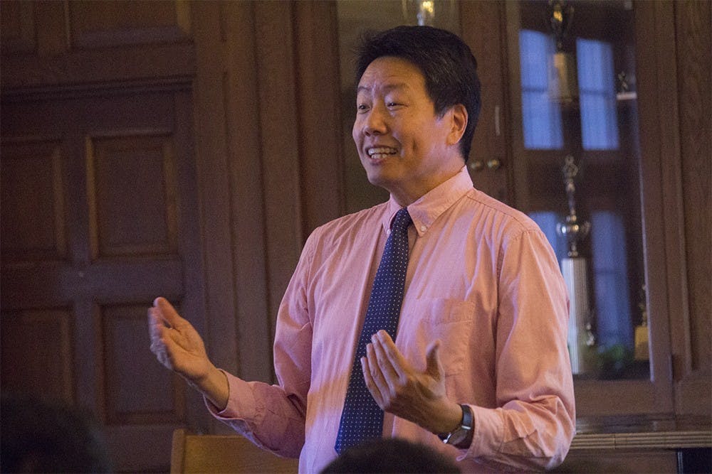 Kent Long, founding president of the Asian Pacific American Labor Alliance, speaks with students on the topic of "Voices of Economic Justice" on Wednesday evening. The event was a part of the Asian Culture Center's Over a Cup of Tea series which is supported by the College of Arts and Sciences' Themester.