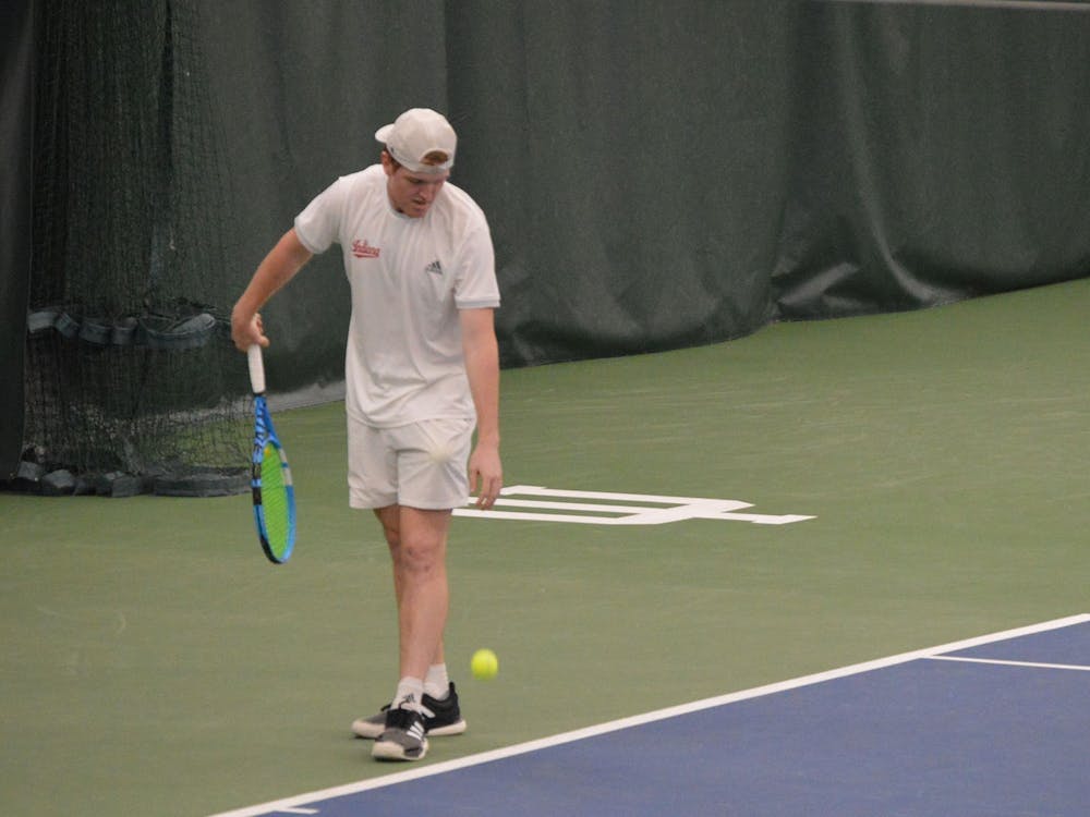 Then-junior Patrick Fletchall prepares to serve the ball April 11, 2021, at the IU Tennis Center. Indiana participated in the ITA Ohio Valley Regional Championships in Louisville this week.