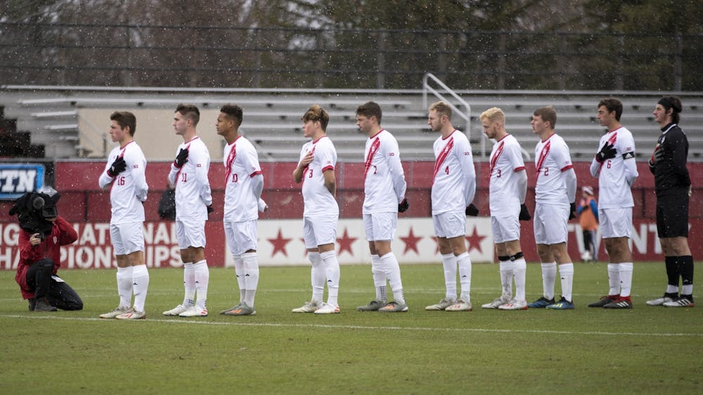 IU men’s soccer stands during the National Anthem on Dec. 1, 2019, at Bill Armstrong Stadium. The Hoosiers beat the Ohio State Buckeyes 3-0 on Tuesday, led by two goals from sophomore forward Victor Bezerra.
