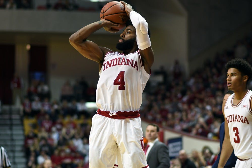 <p>Senior guard Robert Johnson takes a shot against Northwestern on Sunday evening in Simon Skjodt Assembly Hall. IU defeated Northwestern, 66-46, to move to 11-7 (4-2) on the season.</p>