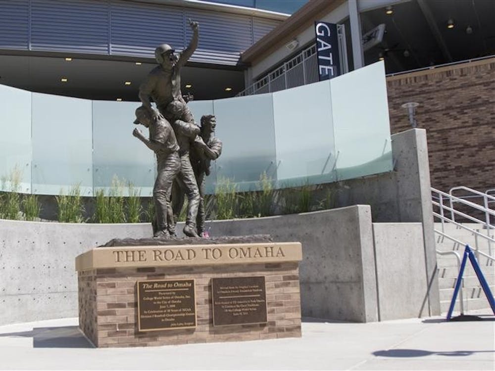 The Road to Omaha statue outside of Gate 1 at TD Ameritrade Park attracts visitors and welcomes College World Series fans to Omaha.