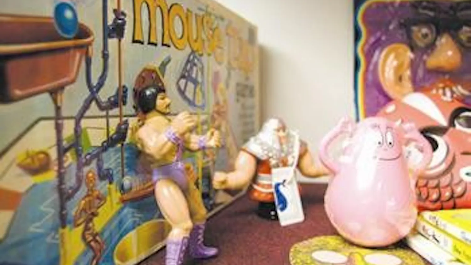 Figurines and a game of Mouse Trap occupy the shelves of the Curiodrome on Monday afternoon. The Curiodrome, on East Sixth Street, is a consignment shop and art flea market that opened last week.