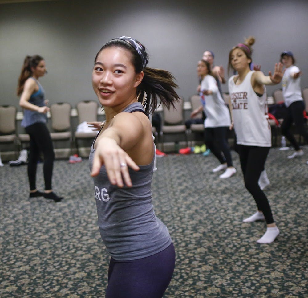 Junior Jessilyn Gibas workouts Monday at the State Room East in the Indiana Memorial Union. Members of "Changing Health, Attitudes, and Actions to Recreate Girls" (CHAARG) is a student organization to promote positive idea of fitness to female college students since 2012. The organization has 18 different university branches, including IU. The members gather and workout every week. 