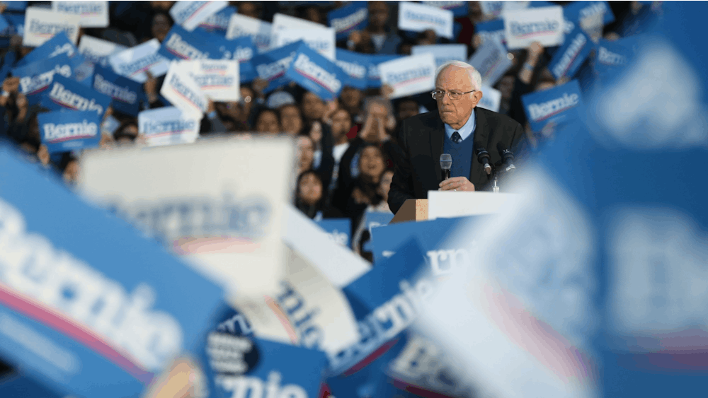 The crowd applauds as then-presidential candidate Sen. Bernie Sanders speaks during a rally at the University of Michigan main quadrangle on March 8 in Ann Arbor, Michigan.Sanders dropped out of the presidential race Wednesday.