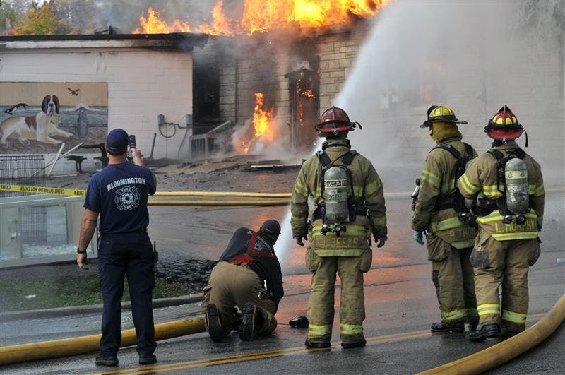 Bloomington fire fighters battle a blaze on Nov. 3 at Delilah's Pet Shop, 1320 N. College Ave. Fire fighters worked for three hours to extinguish the fire, which destroyed the building and killed 20 animals.