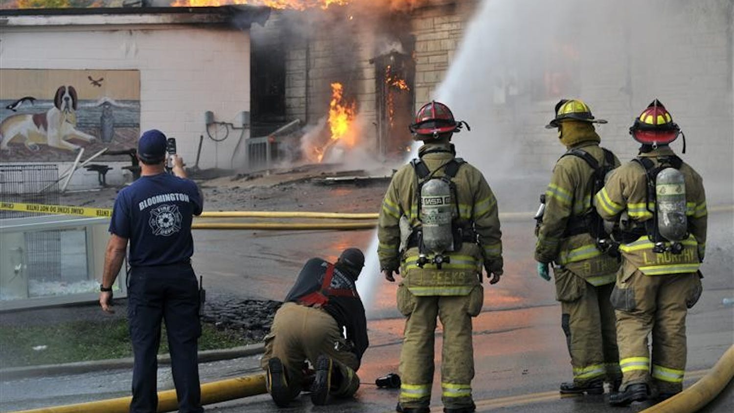 Bloomington fire fighters battle a blaze on Nov. 3 at Delilah's Pet Shop, 1320 N. College Ave. Fire fighters worked for three hours to extinguish the fire, which destroyed the building and killed 20 animals.