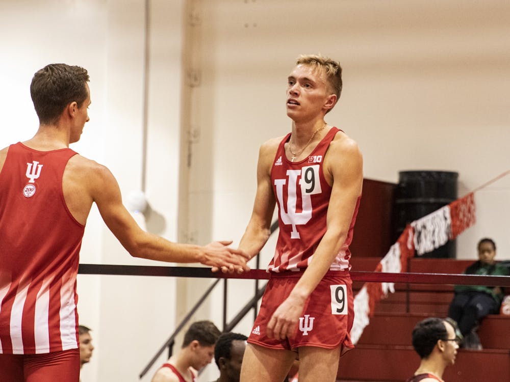 Junior distance runner Ben Veatch looks at the race results after running the 3000 meter run Feb. 14 in Gladstein Fieldhouse. IU won the Big Ten Indoor Championship Feb. 28-29 in Geneva, Ohio.