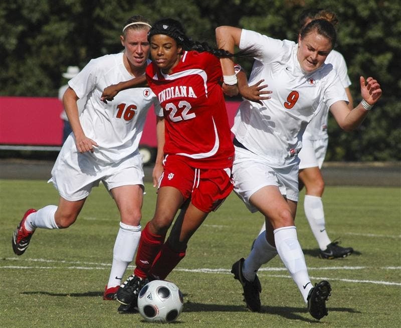 IU's Jocelyn Moses fights with two Illinois defenders during IU’s 1-0 victory Sunday at Bill Armstrong Stadium.