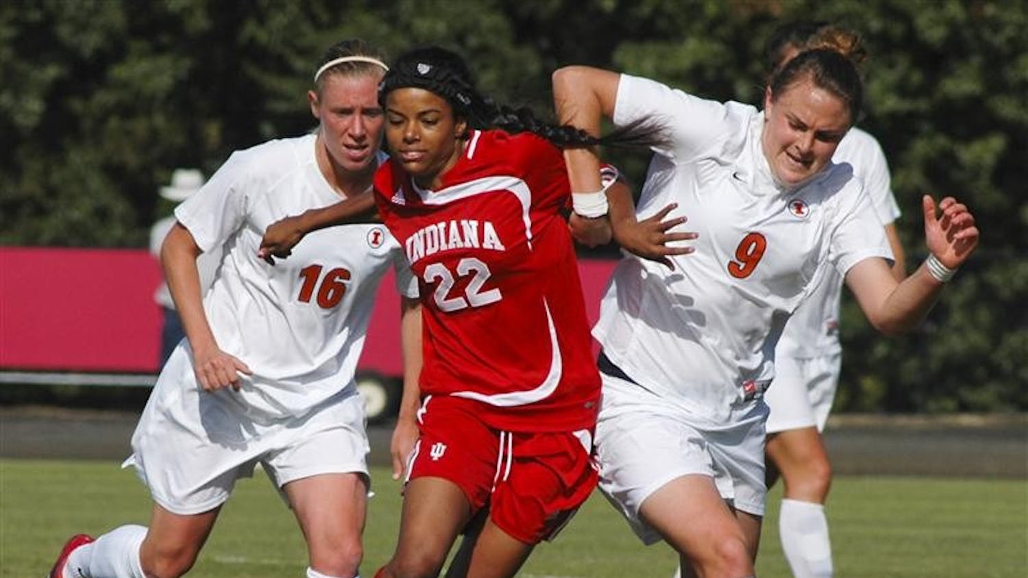 IU's Jocelyn Moses fights with two Illinois defenders during IU’s 1-0 victory Sunday at Bill Armstrong Stadium.
