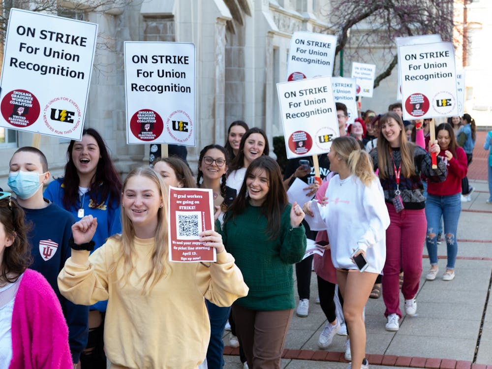 Undergraduate students from Jen Maher&#x27;s gender studies class are seen participating in a march outside of the Chemistry Building on April 14, 2022. 