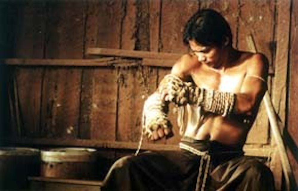 Tony Jaa is giving himself the worst Indian burn ever to prove his manliness.