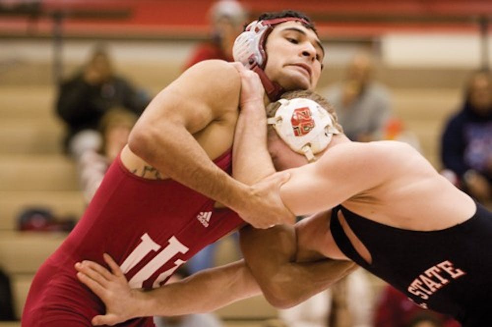 IDS FILE PHOTO
IU sophomore Andrae Hernandez grapples with a wrestler from NC State Saturday, Feb. 2, 2007.
