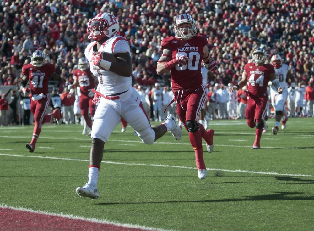 Safety Chase Dutra chases down Rutger's running back Robert Martin as he scores Saturday at Memorial Stadium. The Hoosiers lost, 52-55.