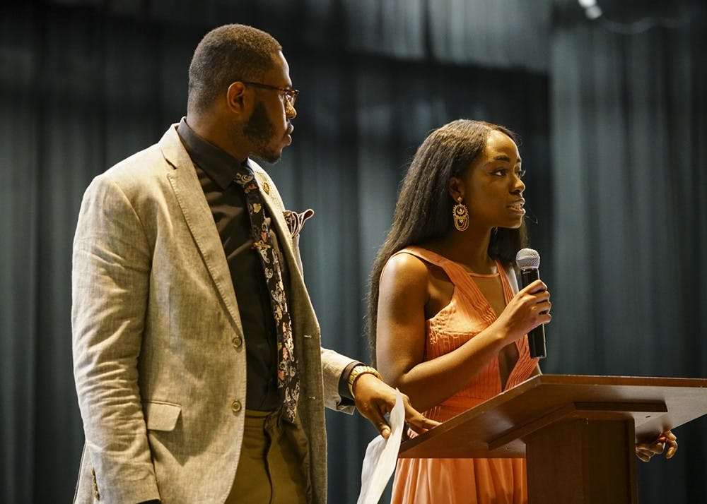 <p>African Students’ Association President Dara Adeosun and Alpha Phi Alpha Vice President Morris Dolley open the Banquet Dinner Saturday evening in the Willkie Auditorium. The annual event was hosted by ASA in collaboration with Alpha Phi Alpha fraternity and Alpha Kappa Alpha sorority to raise money for Freetown, Sierra Leone, with World Hope International after the city suffered heavy flooding and mudslides in August.</p>