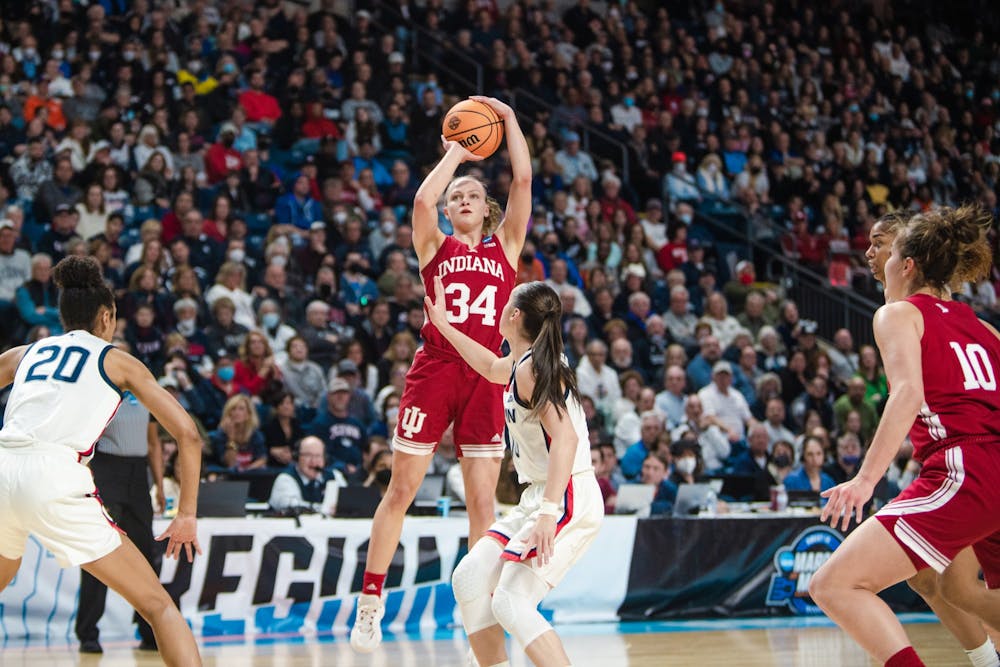 <p>Then-senior guard Grace Berger shoots a 3-pointer March 26, 2022, at Total Mortgage Arena in Bridgeport, Connecticut. The Big Ten announced Indiana’s 2022-23 women’s basketball schedule on Wednesday, which includes 18 regular-season conference games this season.</p>