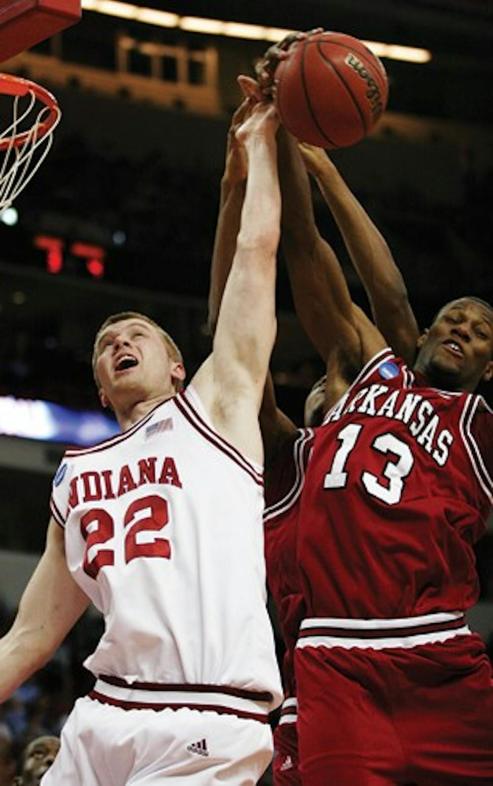 Jacob Kriese IDS
IU senior forward Lance Stemler competes for a rebound against Arkansas' Sonny Weems during the first round of the NCAA tournament Friday night in Raleigh, NC.  Weems led the Razorbacks with 31 points in the 86-72 victory over the Hoosiers.