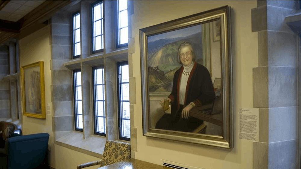 A portrait of Elinor Ostrom painted by Bonnie Sklarski hangs in the Indiana Memorial Union.