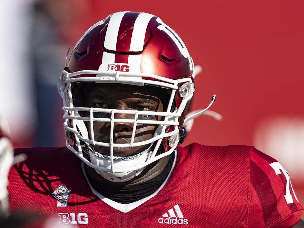 Then-sophomore offensive lineman Matthew Bedford looks at his offensive line coach Darren Hiller on Oct. 24, 2020, in Memorial Stadium. Indiana will play it's season opener Sept. 2 against Illinois in Bloomington.