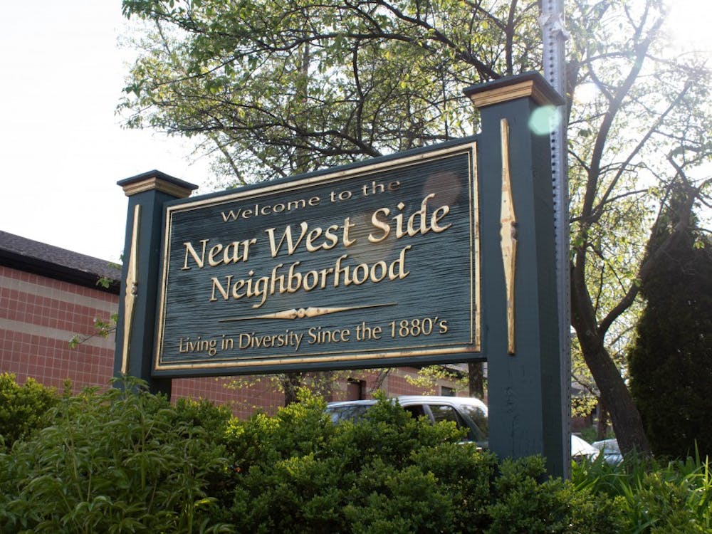 A Near West Side Neighborhood sign stands at the intersection of Sixth and Rogers streets. The neighborhood has been developing since 1884, according to the city&#x27;s official website.