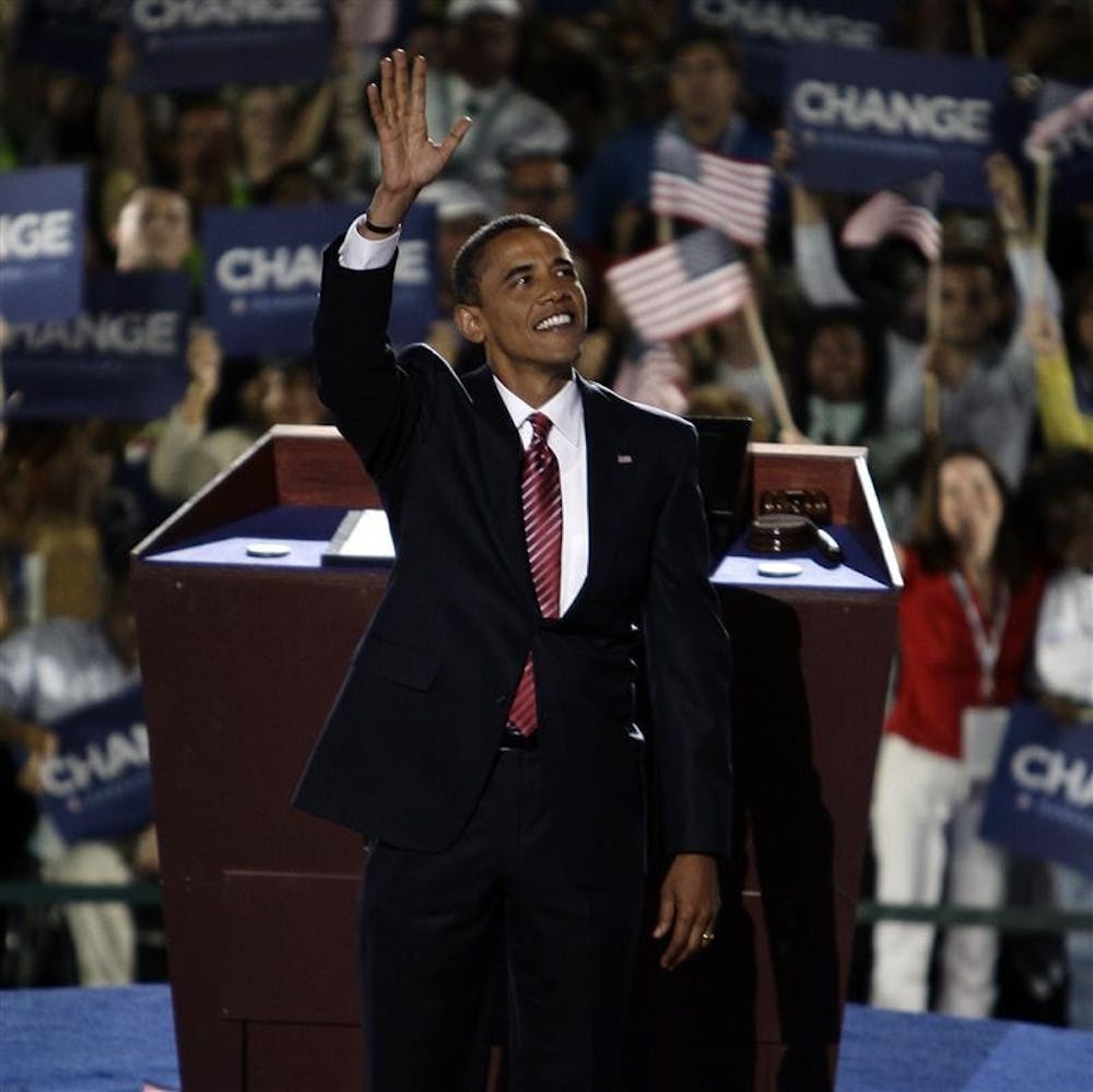Democratic presidential candidate, Sen. Barack Obama, D-Ill., waves to the crowed on the final night of the Democratic National Convention at INVESCO Field in Denver. 