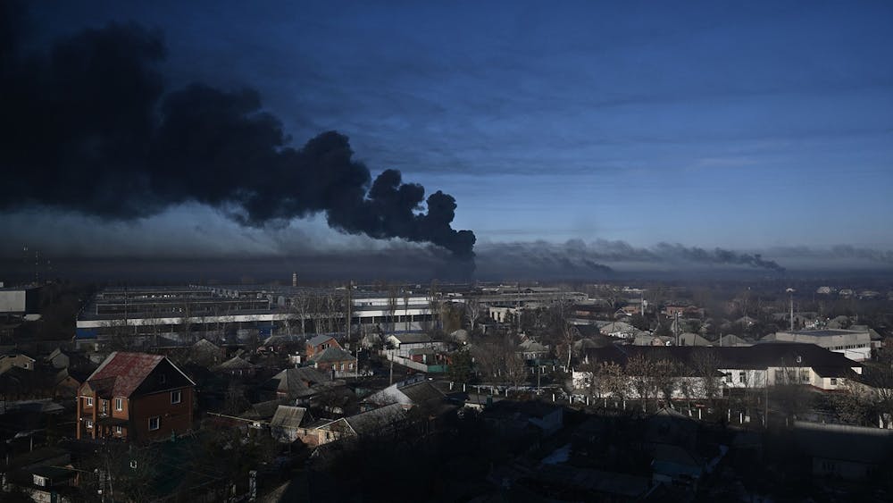 Black smoke rises on Feb. 24, 2022, from a military airport in Chuguyev, Ukraine, near Kharkiv. More than 600 viewers attended a Thursday afternoon Zoom panel discussion regarding Russia&#x27;s attack on Ukraine.