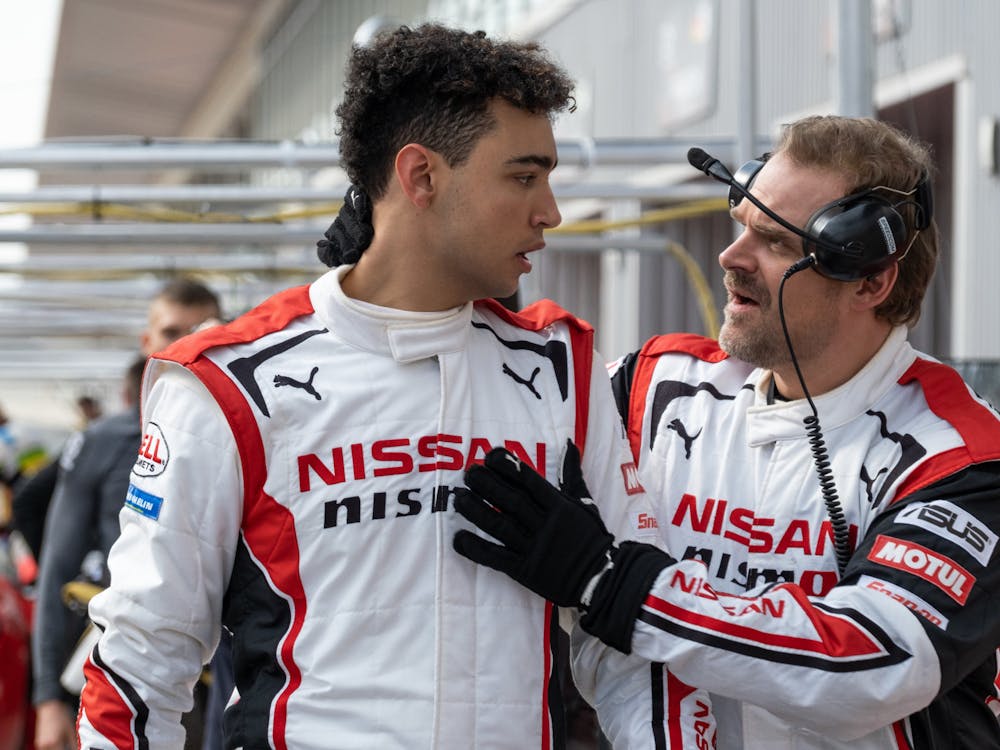 Archie Madekwe (left) and David Harbour (right) are seen in &quot;Gran Turismo.&quot; 