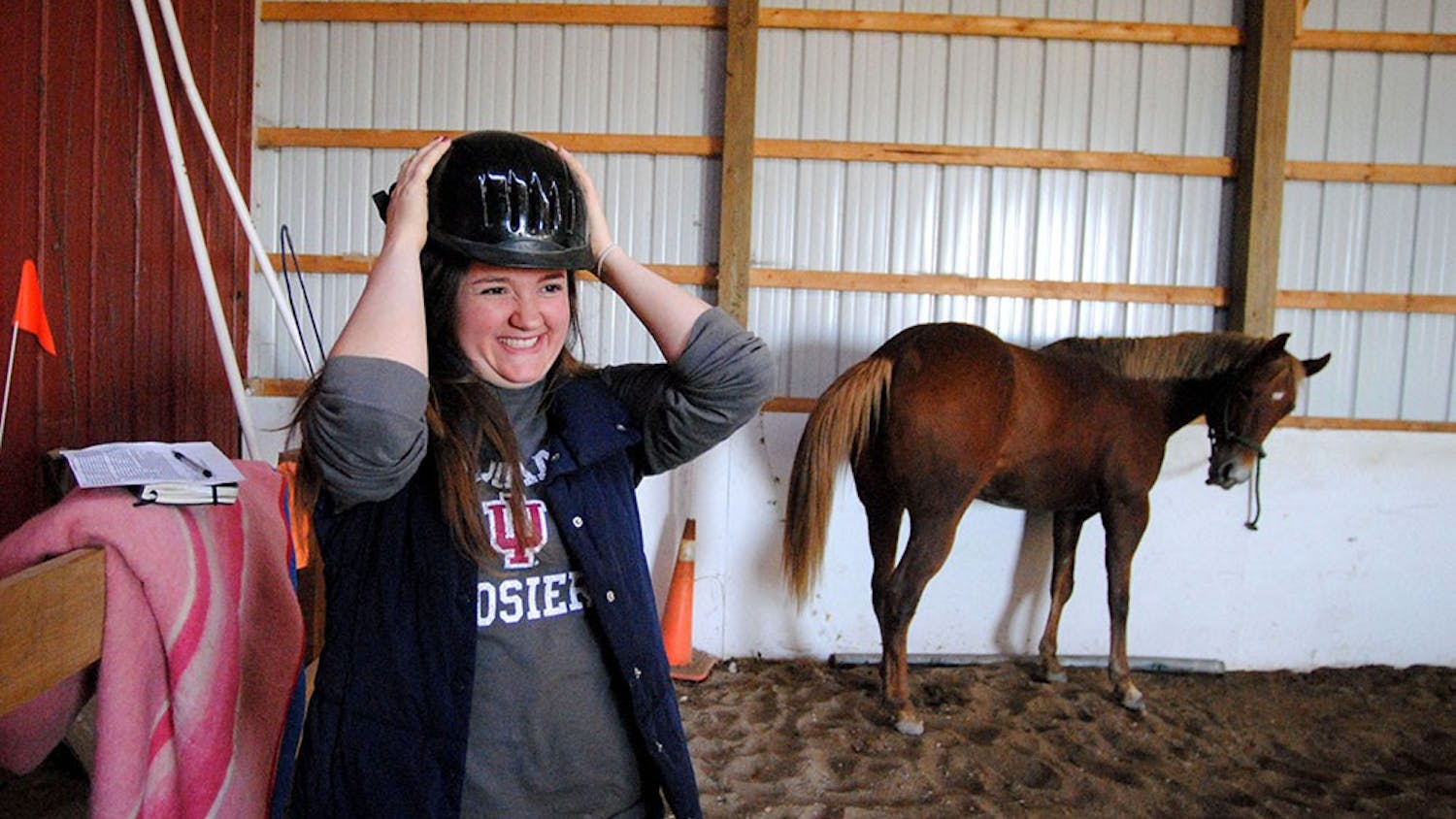 One Sunday afternoon in October, Emily prepares for her horseback riding lesson with Gracie (right) at the Majik Equine Rescue in Cloverdale, IN. Before reenrolling in classes this semester, she developed a self-care routine to stay focused on moving forward. 