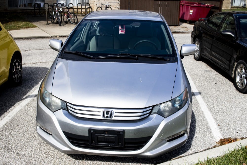 A Honda Insight sits in a parking lot Sept. 23 at University East Apartments. 