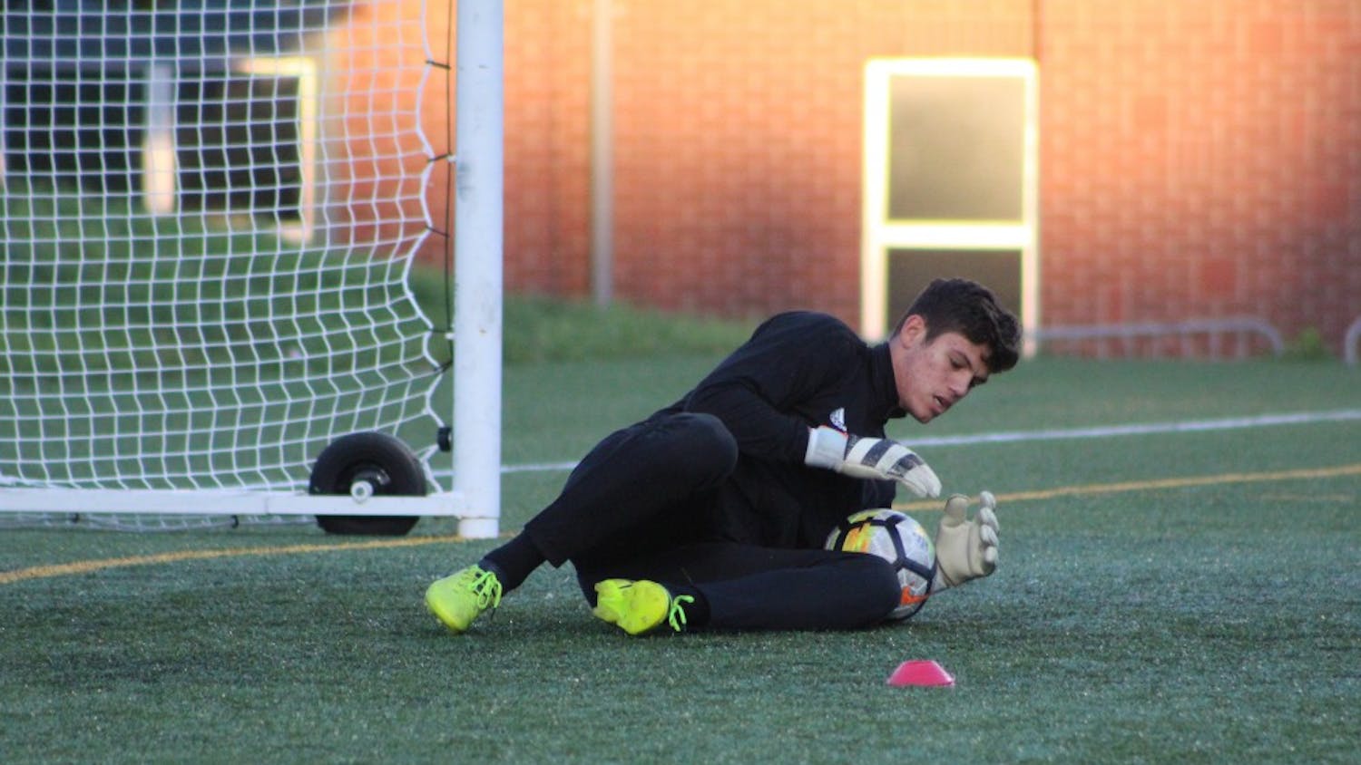 Freshman goalkeeper Trey Muse saves a shot during warm-ups before IU’s match against the Butler Bulldogs Oct. 18 in Indianapolis. Muse allowed no goals during the IU Credit Union/Adidas Classic.&nbsp;
