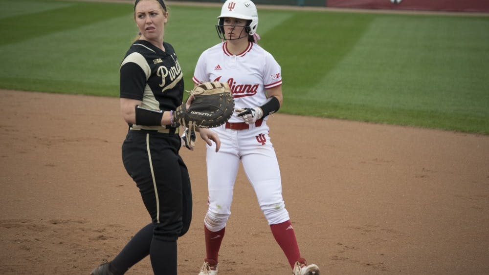 Gabbi Jenkins runs back to first after taking a bold lead off first base.  The lefty had the first hit of the game in the double header against Purdue.