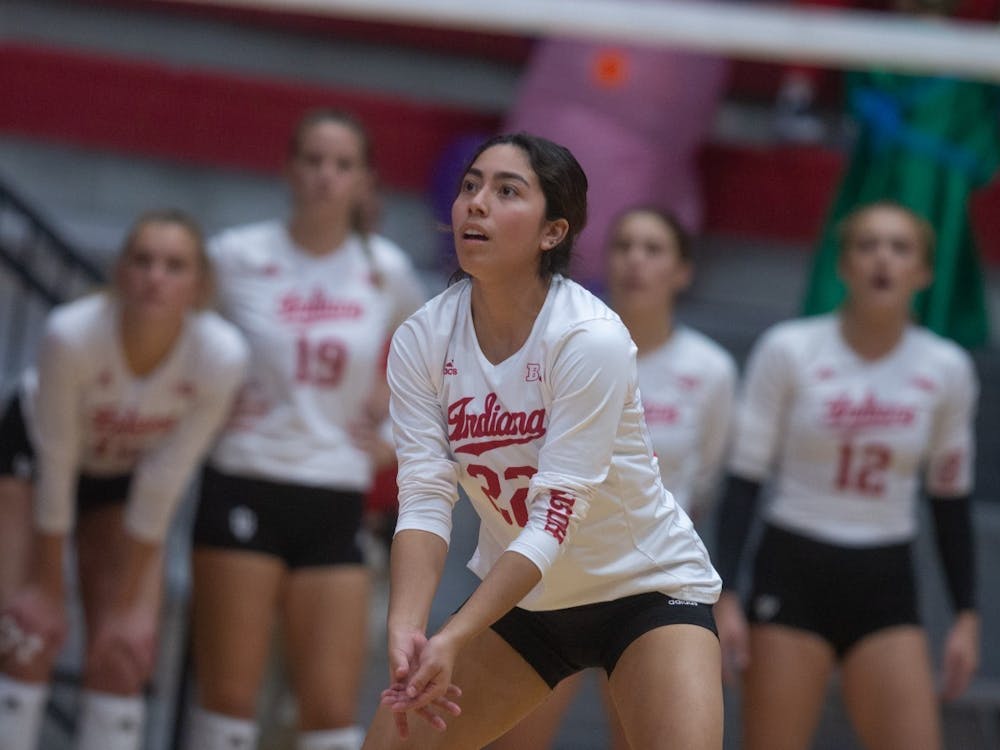 Junior defensive strategist Isa Lopez prepares to bump the ball during a volleyball game against Rutgers on Oct. 28, 2022. IU lost 3-0 against Minnesota on Nov. 13.