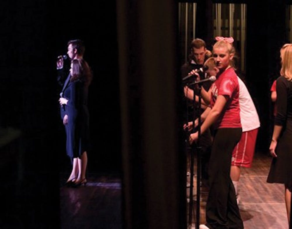 File photoOverall winners Gamma Phi Beta and Phi Sigma Kappa set up backstage while the IU Sing Singers entertain the crowd February 16, 2007 at the IU Auditorium.