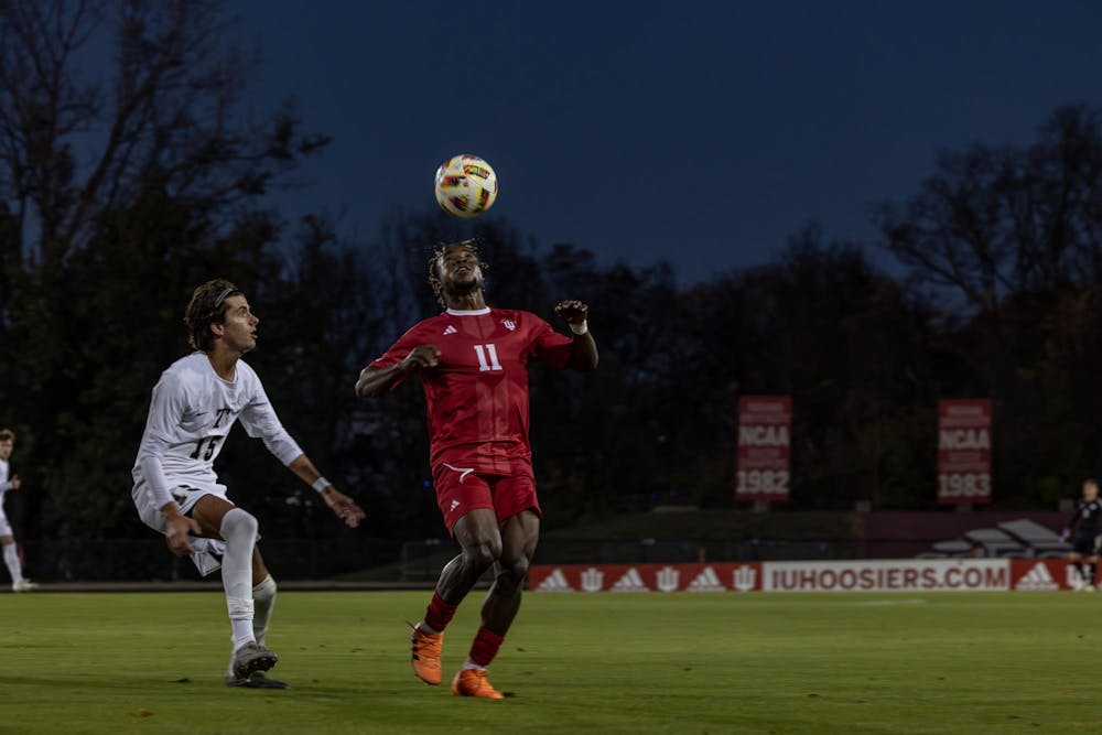 Sophomore Collins Oduro headbutts the ball in a game versus Trine Nov. 1, 2024 at Bill Armstrong Stadium in Bloomington. The Hoosiers celebrated senior night before the game and at halftime.