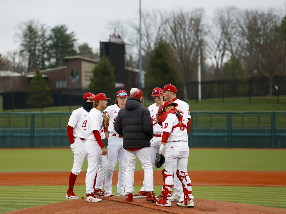 Indiana gathers during a timeout March 10, 2023, at Bart Kaufman Field. Luke Sinnard has struck out 39 batters through five starts this season.