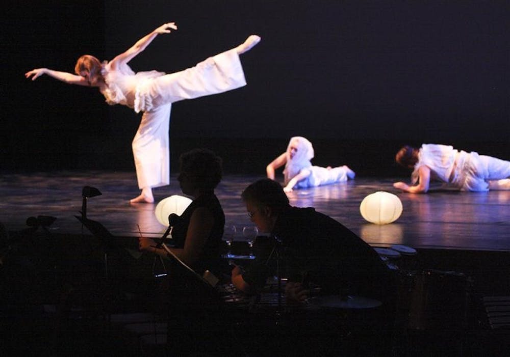 Students perform "A Strange Peace" Saturday evening at the Buskirk-Chumley Theater. Composed by graduate student Jonathan Sokol and choreographed by junior Utam Moses, the piece was one of fourteen original student works in the "Hammer and Nail" performance.