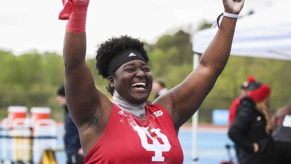 Junior Khayla Dawson celebrates her shot put throw of 17.65 meters. The throw won first place at the Big Ten Championships May 11 in Iowa City, Iowa. 