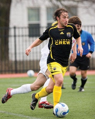 Former Hoosier and current member of the Columbus Crew Ned Grabavoy moves the ball up the field during IU’s 1-0 loss against the Columbus Crew on Saturday.