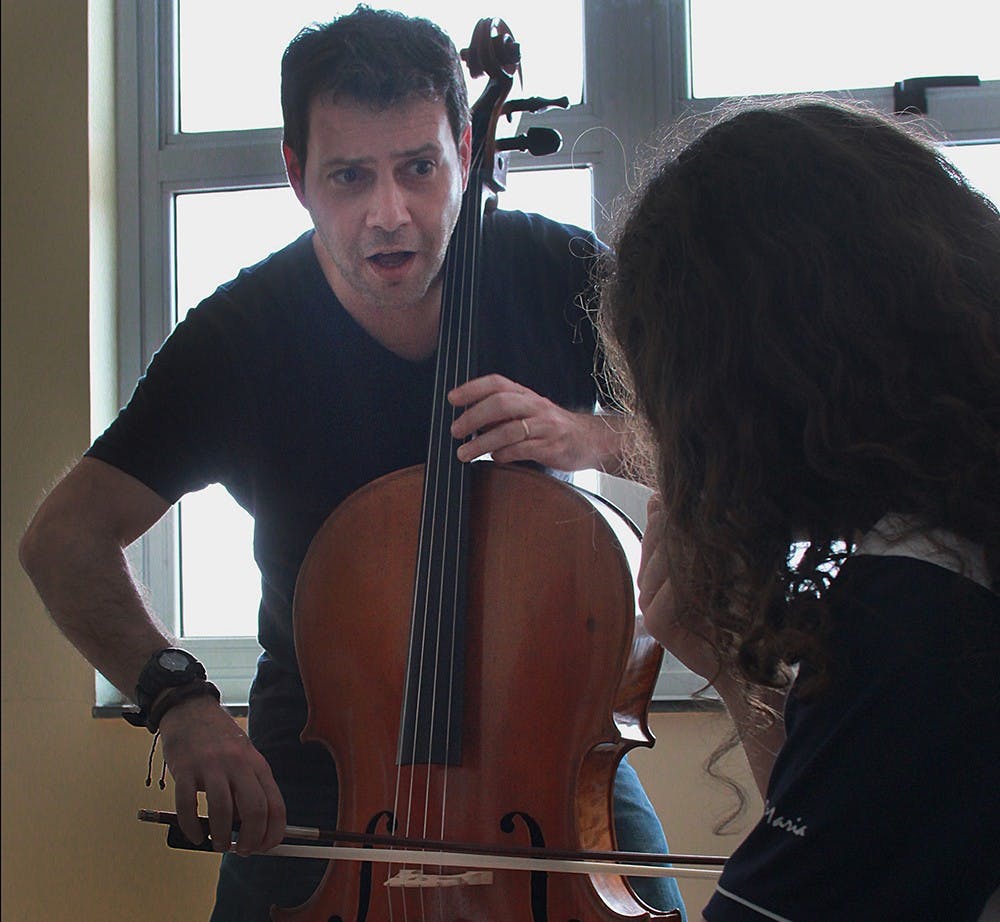 André Micheletti, a Jacobs School of Music alumnus, instructs Luiz Fernando during a private lesson on November 10, 2014. At age 14 Fernando was the youngest Brazilian to perform at Carnegie Hall.