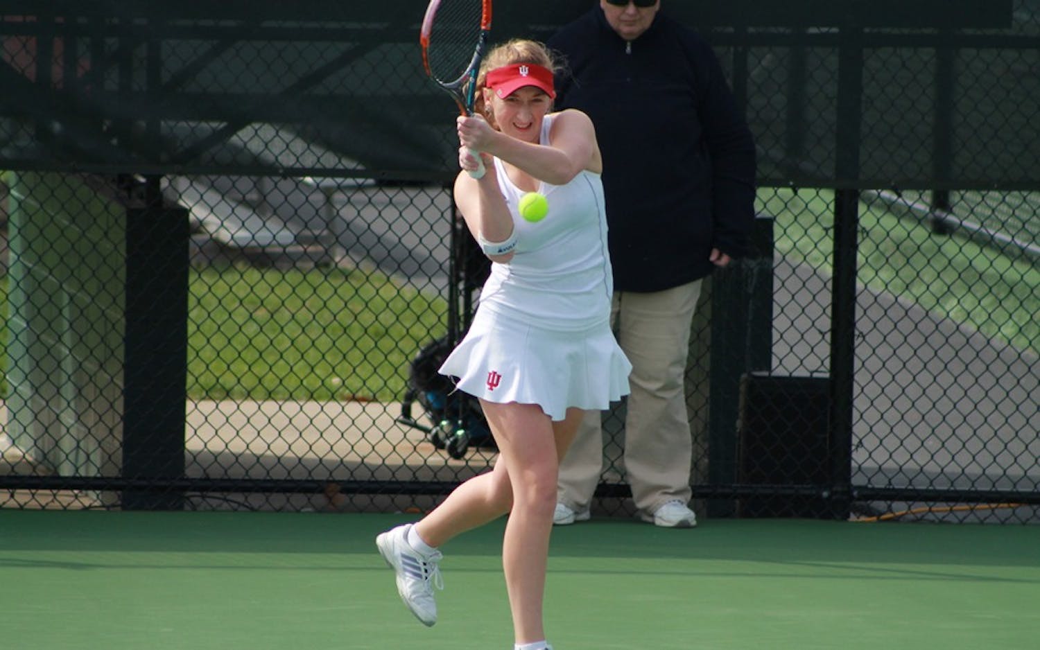 Senior Kim Schmider waits for the ball in a doubles match last Sunday morning. The Hoosiers fell to the Golden Eagles, 4-2.