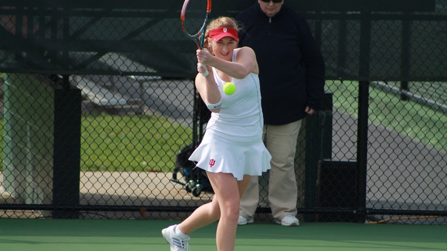 Senior Kim Schmider waits for the ball in a doubles match last Sunday morning. The Hoosiers fell to the Golden Eagles, 4-2.